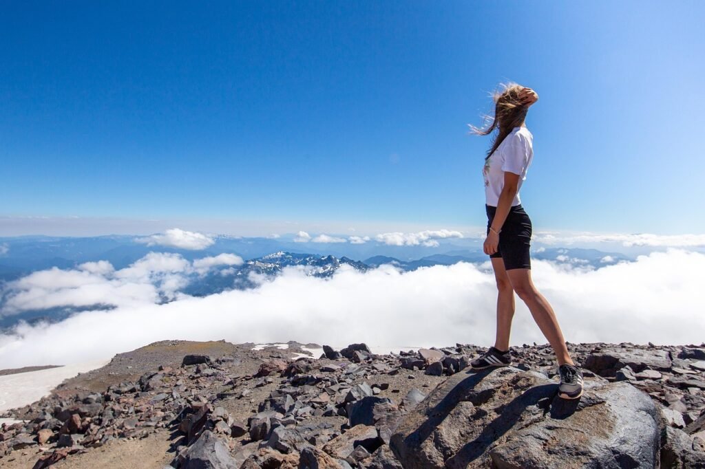 woman, peak, summit, clouds, sea of clouds, rocks, mountains, highlands, horizon, sky, nature, landscape, girl, travel, adven