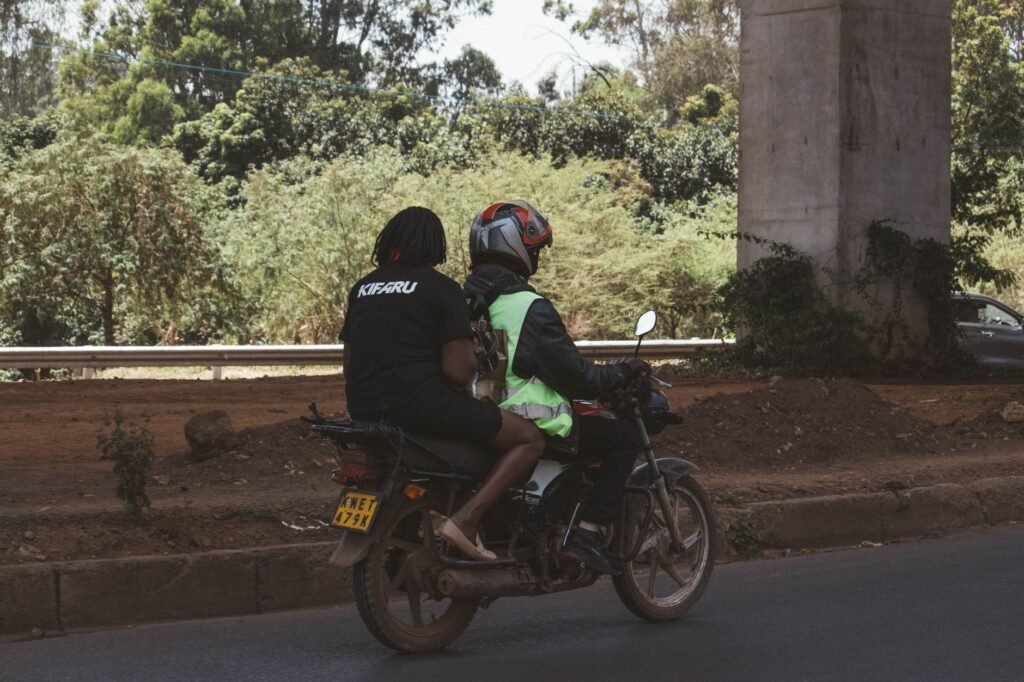 Boda-boda motorbike parked on a rural road in Kenya in late afternoon light