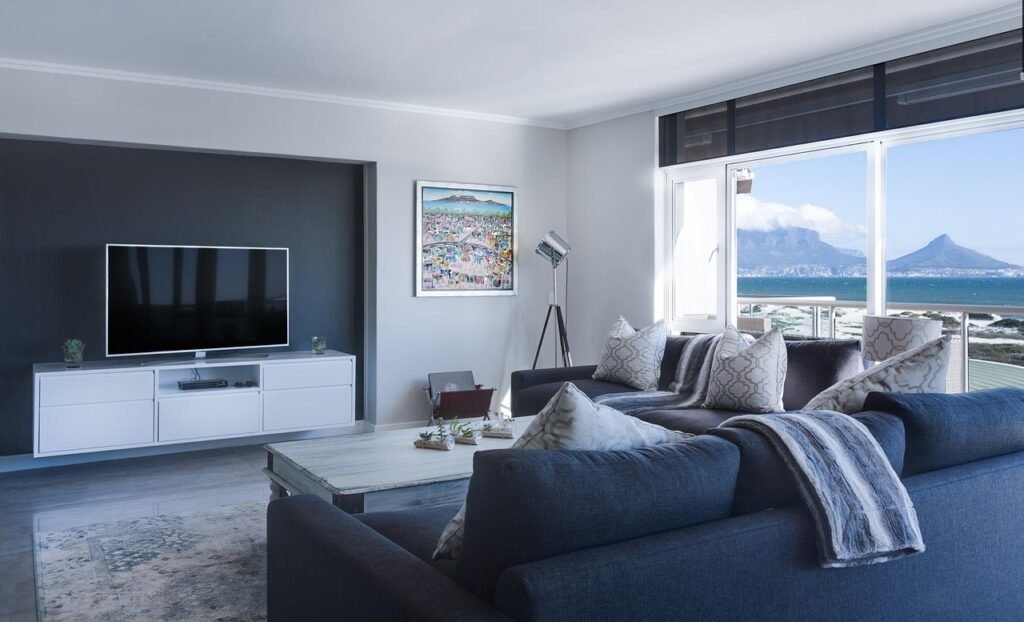 modern minimalist lounge, sea view, window, table bay, cape town city bowl, contemporary, indoors, inside, interior, interior