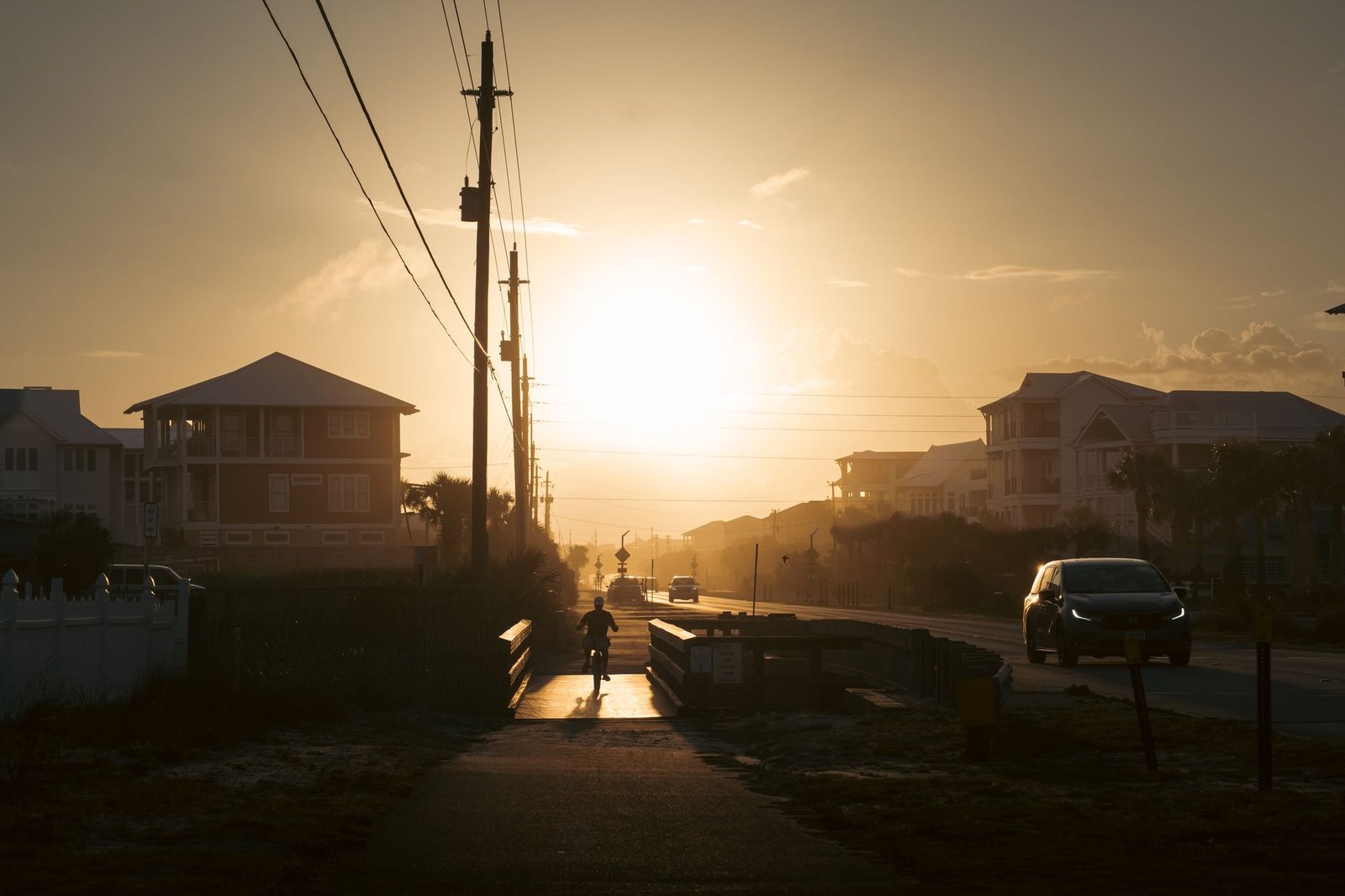 Quiet residential street in a coastal Kenyan town at golden hour