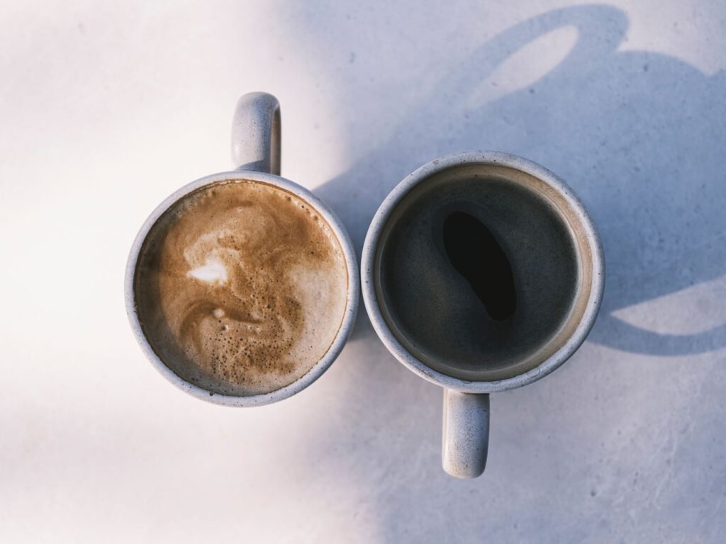 Two cups of coffee on a cafe table, suggesting a calm first meeting
