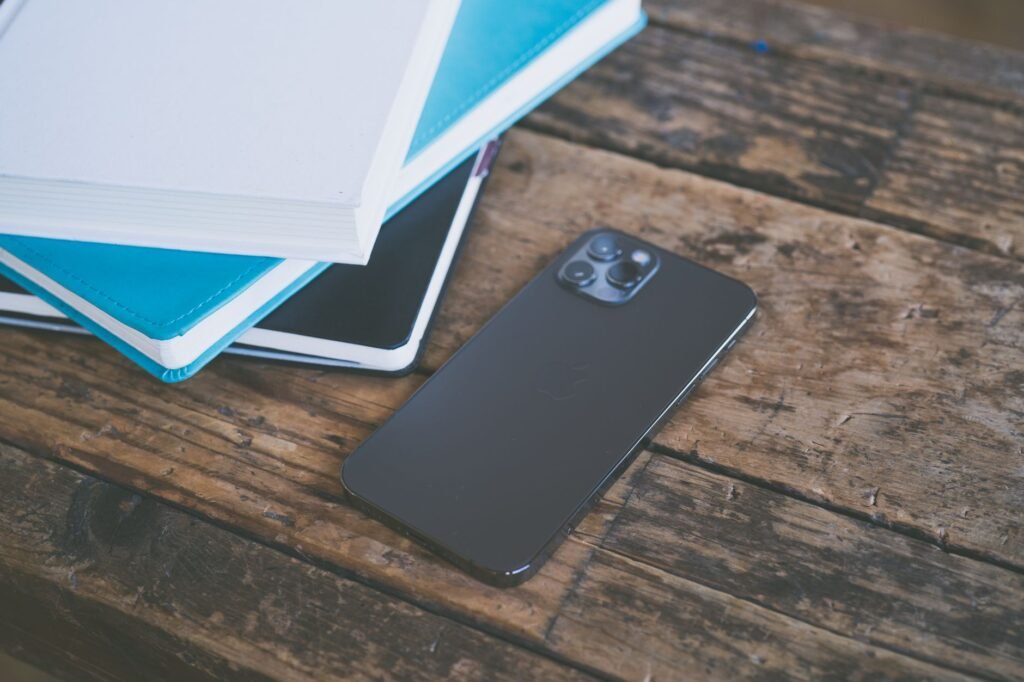 A phone and keys on a table, suggesting discretion and careful planning