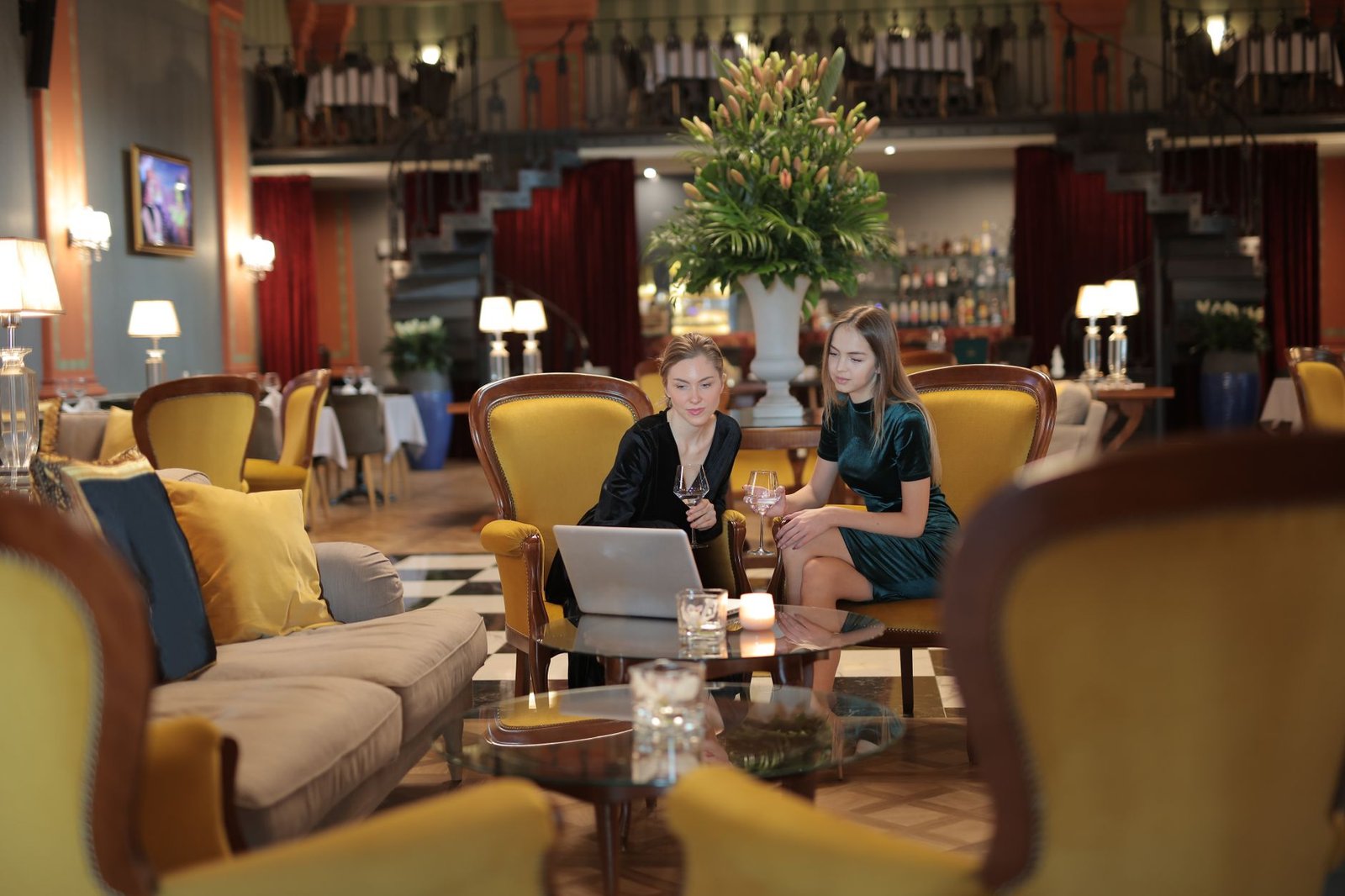 Two adults talking politely across a table in a modern hotel lounge
