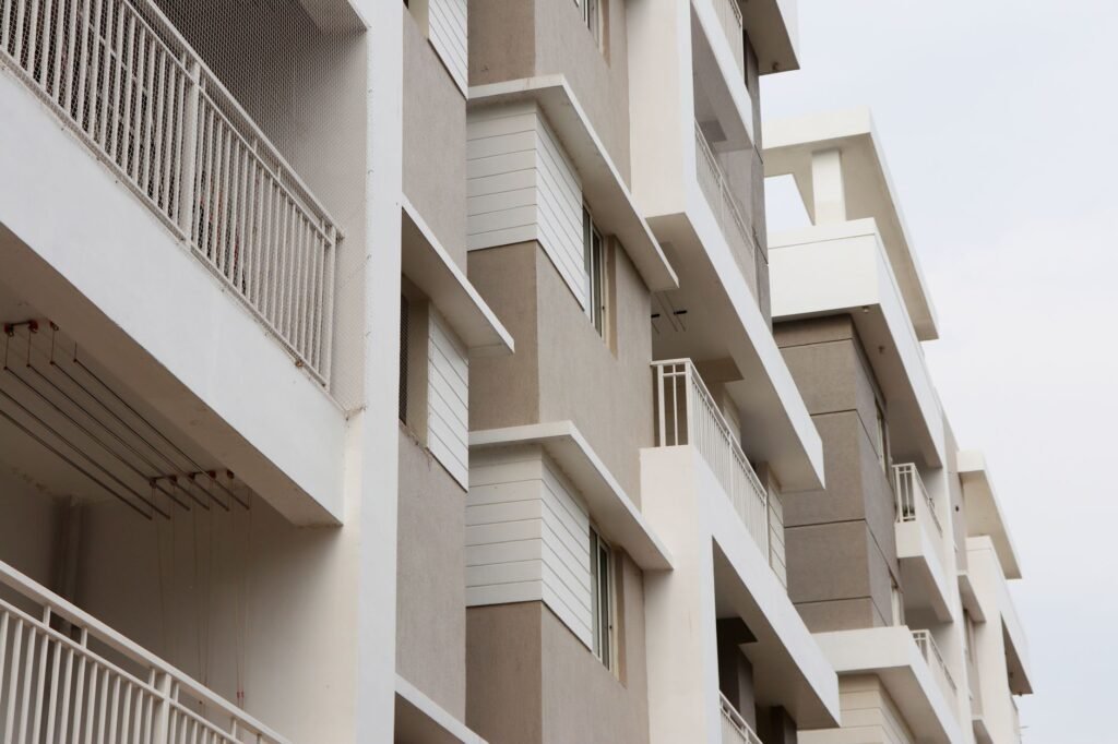Low angle view of modern apartment buildings in Hyderabad, showcasing urban architecture and exterior design.