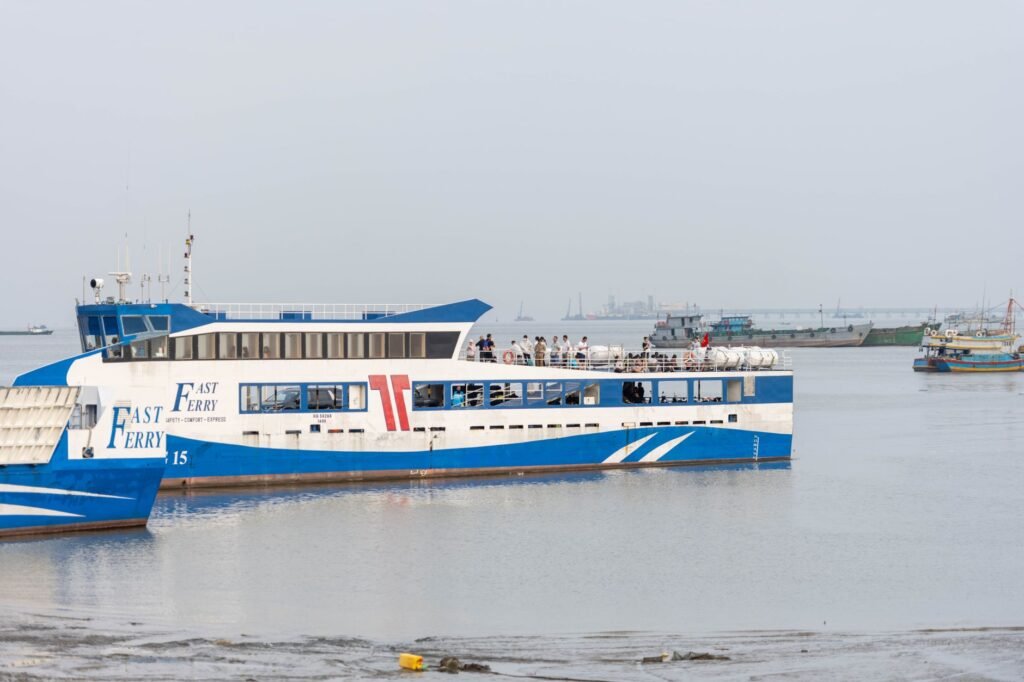 Fast ferry navigating the calm waters near Vũng Tàu, Vietnam, with passengers aboard.