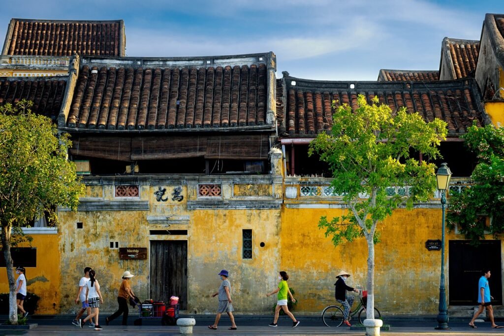 people, street, hoi an, sidewalk, bicycle, town, walking, cycling, buildings, old buildings, old town, ancient town, historic