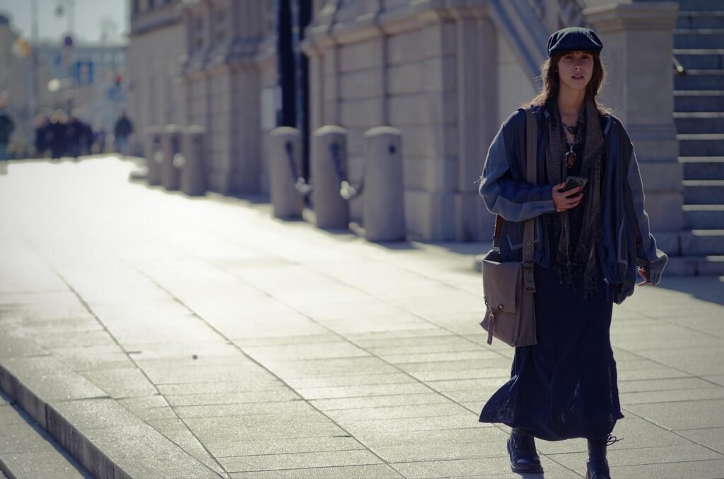 fashion, purse, urban, city, woman, casual, caucasian, walking, pavement, sidewalk, street, buildings, cap, bag, sunny, snaps