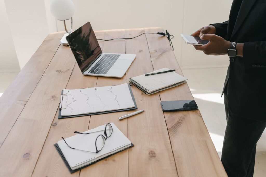 Smartphone and notebook on a table, representing careful profile reading