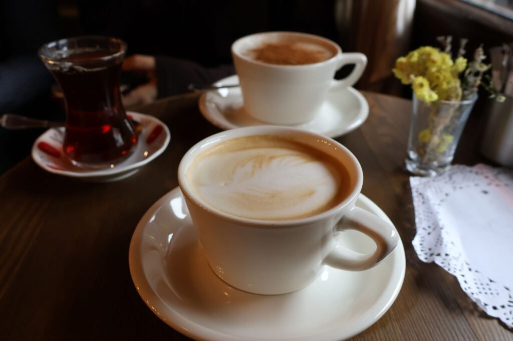 Two cups of tea on a quiet cafe table before a discreet meeting