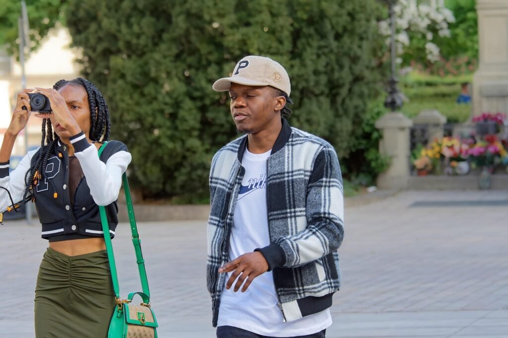people, tourists, couple, young couple, africans, casual, walking, street, urban, photographing, city, taking pictures, takin