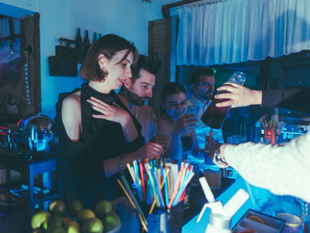 Friends enjoying a vibrant nightlife atmosphere at a trendy bar.