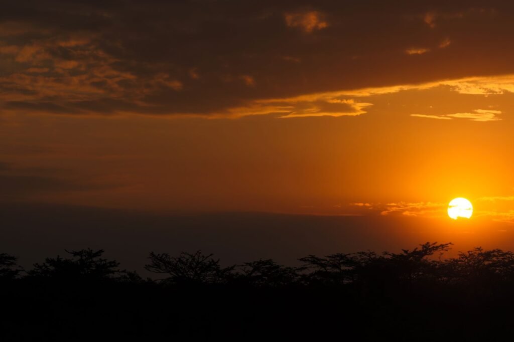 Stunning sunset with vibrant colors over the African landscape in Nakuru, Kenya showcasing nature's beauty.