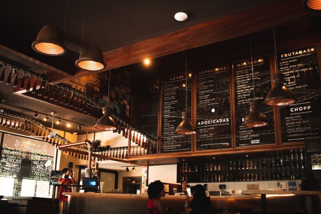 Warm and inviting café interior featuring wooden decor and ambient lighting.