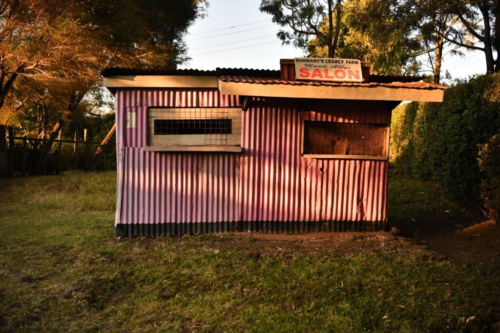A rustic salon in Nairobi, Kenya, beautifully illuminated by the golden light of sunset.